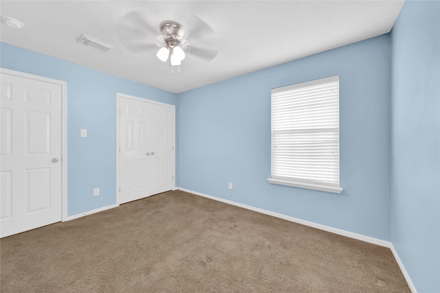 4406 Park Trail Ln, Pasadena, TX 77505 - unfurnished bedroom with carpet, a closet, and ceiling fan