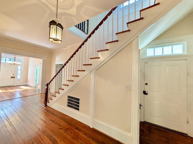 309 E Robert Toombs Ave, Washington, GA 30673 - foyer entrance featuring a chandelier, dark wood-style flooring, and stairway