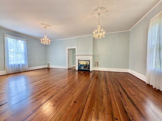 309 E Robert Toombs Ave, Washington, GA 30673 - unfurnished living room with a chandelier, dark wood-style flooring, ornamental molding, and a multi sided fireplace