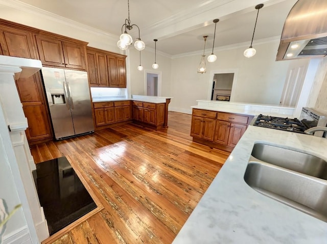 309 E Robert Toombs Ave, Washington, GA 30673 - kitchen featuring custom exhaust hood, stainless steel fridge with ice dispenser, a peninsula, brown cabinets, and wood-type flooring