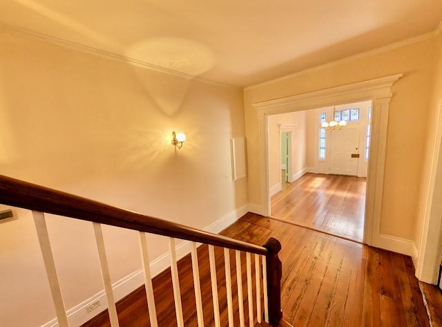 309 E Robert Toombs Ave, Washington, GA 30673 - stairway with wood-type flooring, crown molding, and a chandelier