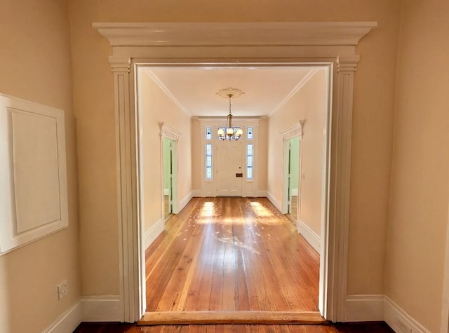 309 E Robert Toombs Ave, Washington, GA 30673 - entrance foyer featuring a chandelier, wood-type flooring, and ornamental molding