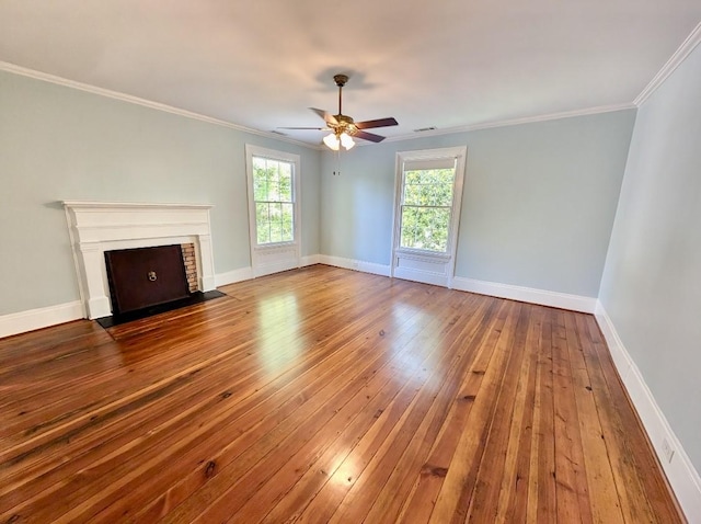 309 E Robert Toombs Ave, Washington, GA 30673 - unfurnished living room with hardwood / wood-style flooring, a ceiling fan, crown molding, and a fireplace with flush hearth