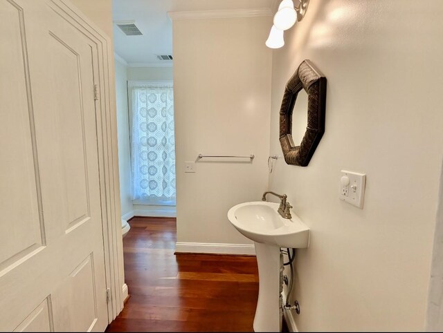 309 E Robert Toombs Ave, Washington, GA 30673 - bathroom featuring ornamental molding and wood finished floors