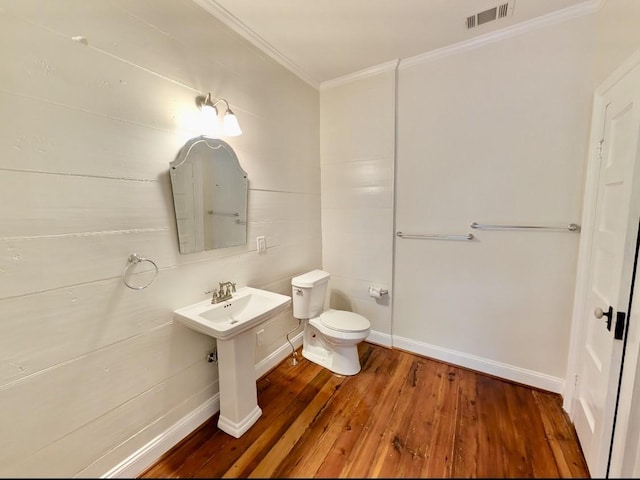 309 E Robert Toombs Ave, Washington, GA 30673 - half bathroom featuring ornamental molding and hardwood / wood-style floors