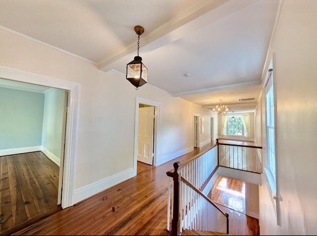 309 E Robert Toombs Ave, Washington, GA 30673 - interior space with an upstairs landing, hardwood / wood-style floors, a chandelier, and crown molding