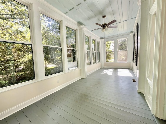 309 E Robert Toombs Ave, Washington, GA 30673 - unfurnished sunroom with baseboards and hardwood / wood-style flooring