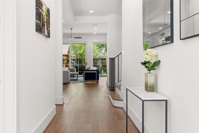 2324 Albans Rd, Houston, TX 77005 - hall featuring recessed lighting, wood finished floors, and stairway