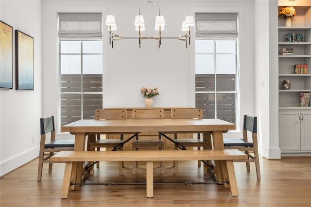 2324 Albans Rd, Houston, TX 77005 - dining area with light wood-style flooring and a chandelier
