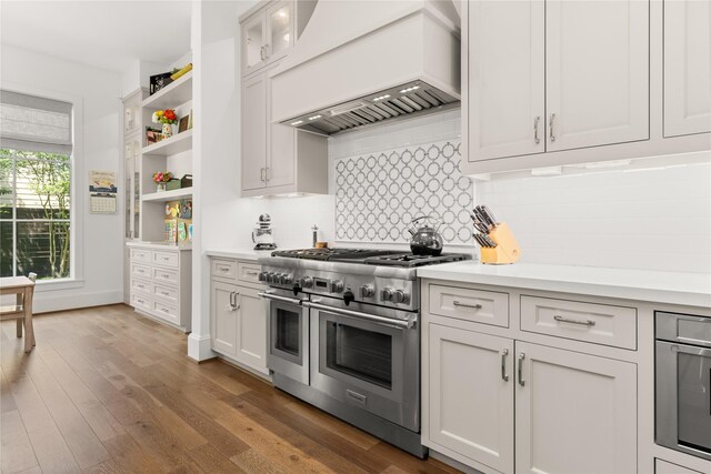 2324 Albans Rd, Houston, TX 77005 - kitchen with appliances with stainless steel finishes, custom range hood, light countertops, open shelves, and tasteful backsplash