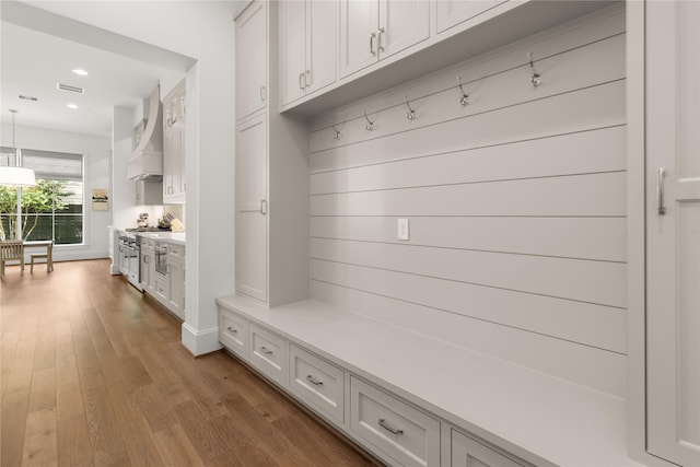 2324 Albans Rd, Houston, TX 77005 - mudroom with wood finished floors and recessed lighting