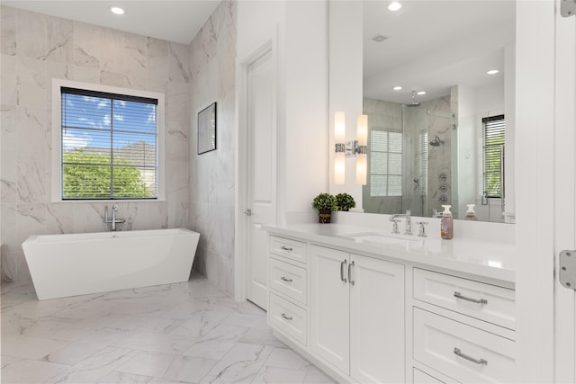 2324 Albans Rd, Houston, TX 77005 - bathroom featuring plenty of natural light, vanity, a marble finish shower, a soaking tub, and recessed lighting