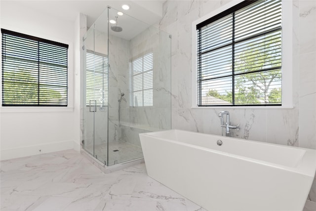 2324 Albans Rd, Houston, TX 77005 - bathroom with plenty of natural light, a marble finish shower, a freestanding tub, and marble finish floors