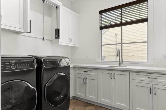 2324 Albans Rd, Houston, TX 77005 - washroom featuring independent washer and dryer, cabinet space, and tile patterned floors
