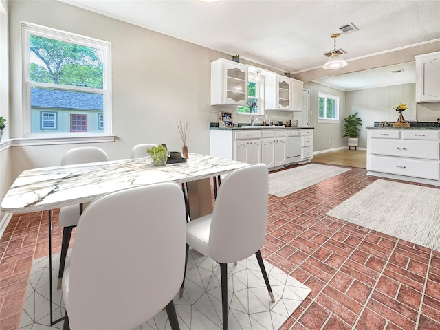 723 Pas Trl, Houston, TX 77336 - dining space featuring baseboards and brick patterned flooring