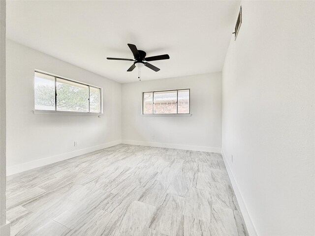 4015 Leeshire Dr, Houston, TX 77025 - spare room featuring baseboards and a ceiling fan