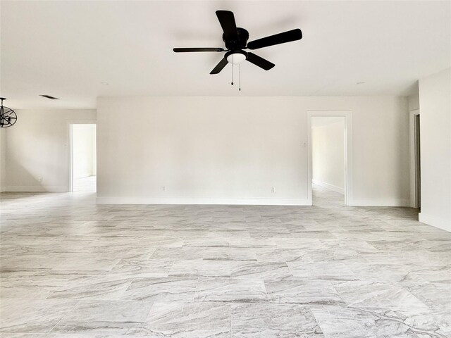 4015 Leeshire Dr, Houston, TX 77025 - spare room featuring a ceiling fan and light marble finish floors