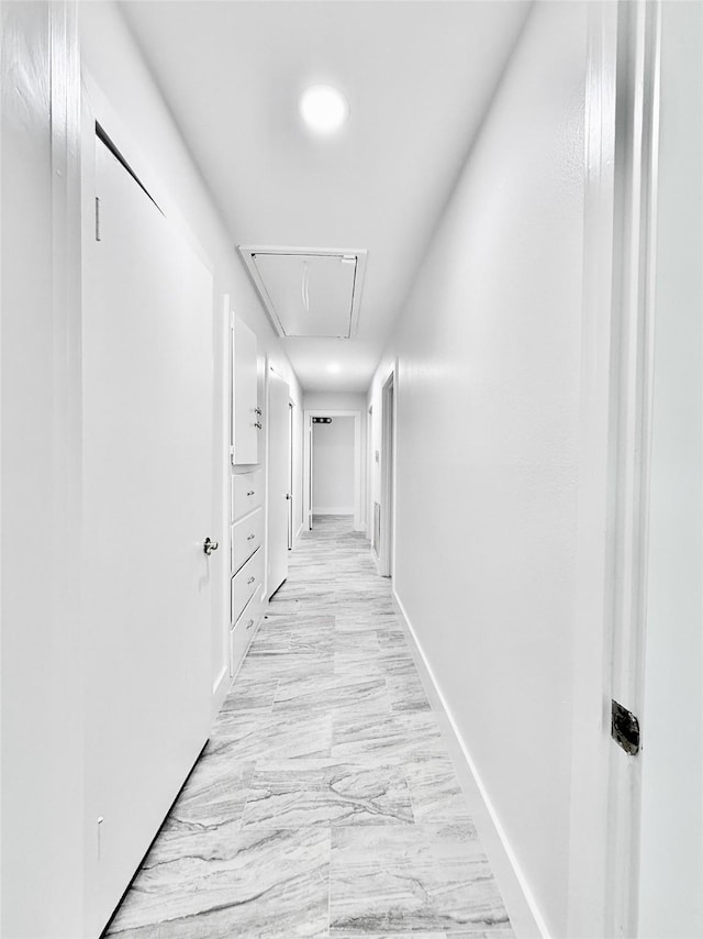 4015 Leeshire Dr, Houston, TX 77025 - corridor with attic access, recessed lighting, and light marble finish flooring