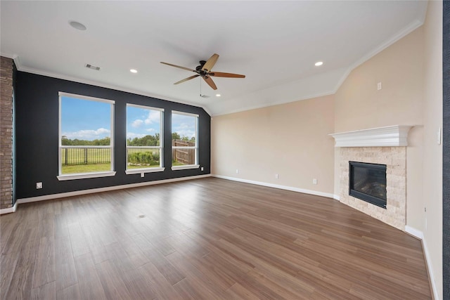 13721 Northline Lake Dr, Houston, TX 77044 - unfurnished living room with a ceiling fan, a glass covered fireplace, ornamental molding, lofted ceiling, and wood finished floors