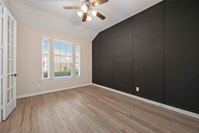13721 Northline Lake Dr, Houston, TX 77044 - unfurnished bedroom featuring light wood-style floors, vaulted ceiling, and a ceiling fan
