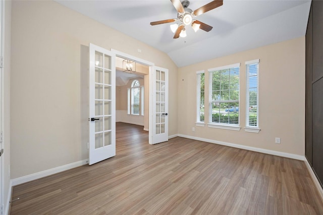 13721 Northline Lake Dr, Houston, TX 77044 - empty room featuring french doors, wood finished floors, lofted ceiling, and a ceiling fan