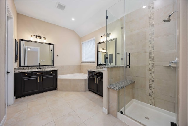 13721 Northline Lake Dr, Houston, TX 77044 - full bath with a stall shower, a bath, two vanities, vaulted ceiling, and tile patterned flooring