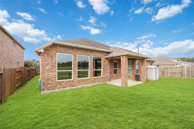 13721 Northline Lake Dr, Houston, TX 77044 - rear view of property featuring a shed, brick siding, a patio, and a fenced backyard