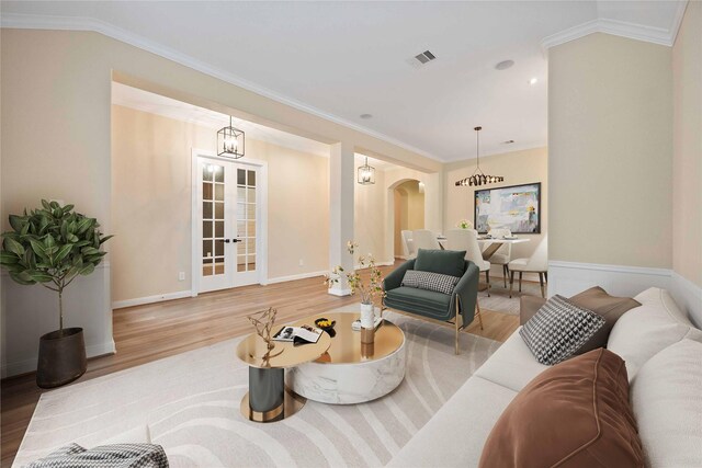 13721 Northline Lake Dr, Houston, TX 77044 - living area with wood finished floors, french doors, arched walkways, and ornamental molding