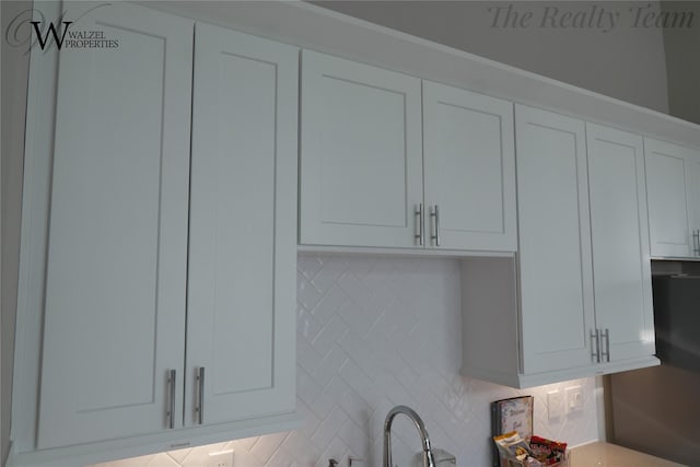5902 Gardendale Dr Unit C, Houston, TX 77092 - kitchen view of decorative backsplash, white cabinets, and light countertops