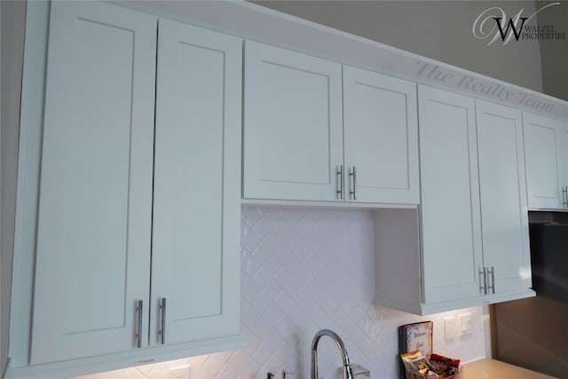 5902 Gardendale Dr Unit C, Houston, TX 77092 - kitchen view of backsplash, white cabinetry, and light countertops