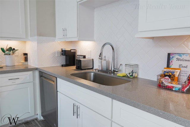5902 Gardendale Dr Unit C, Houston, TX 77092 - kitchen featuring dishwasher, white cabinets, decorative backsplash, and dark stone counters