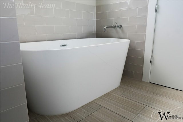 5902 Gardendale Dr Unit C, Houston, TX 77092 - full bathroom featuring tile walls and a freestanding bath