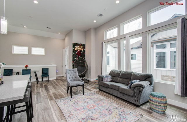 5902 Gardendale Dr Unit C, Houston, TX 77092 - living room featuring wood finished floors and recessed lighting