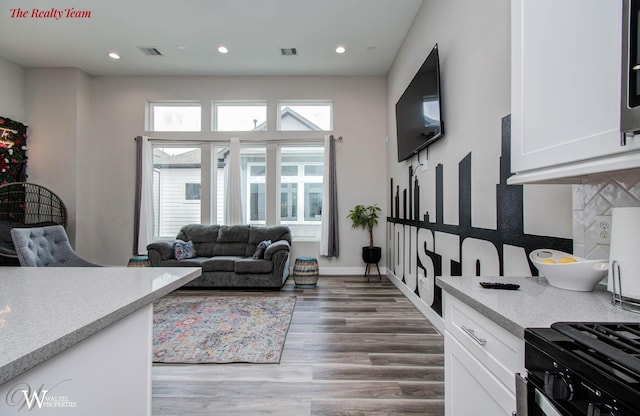 5902 Gardendale Dr Unit C, Houston, TX 77092 - living room featuring wood finished floors and recessed lighting