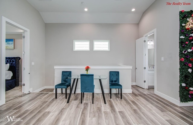 5902 Gardendale Dr Unit C, Houston, TX 77092 - sitting room featuring wood finished floors, lofted ceiling, and recessed lighting