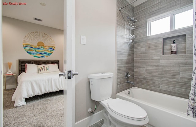 5902 Gardendale Dr Unit C, Houston, TX 77092 - ensuite bathroom featuring shower / tub combo with curtain and baseboards