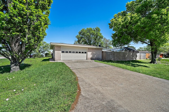 1033 25th Ave N, Texas City, TX 77590 - view of front of house with brick siding, driveway, and a garage