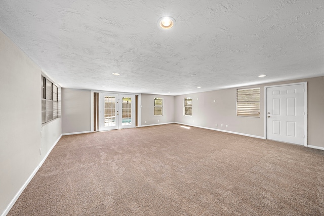 1033 25th Ave N, Texas City, TX 77590 - unfurnished room with a textured ceiling, carpet, and recessed lighting