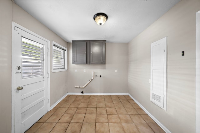 1033 25th Ave N, Texas City, TX 77590 - laundry area featuring cabinet space, gas dryer hookup, washer hookup, and light tile patterned floors