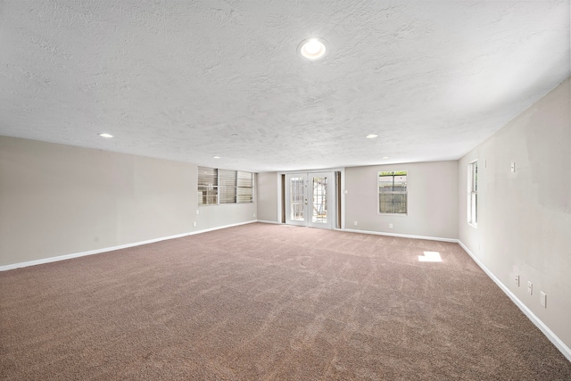 1033 25th Ave N, Texas City, TX 77590 - carpeted spare room featuring a textured ceiling and recessed lighting