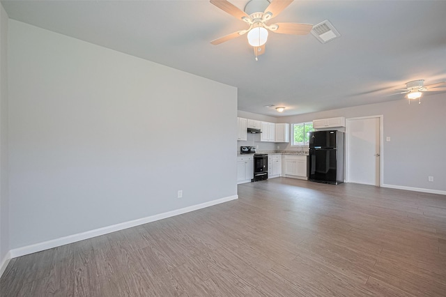 3602 Castledale Dr, Houston, TX 77093 - unfurnished living room with ceiling fan and wood finished floors
