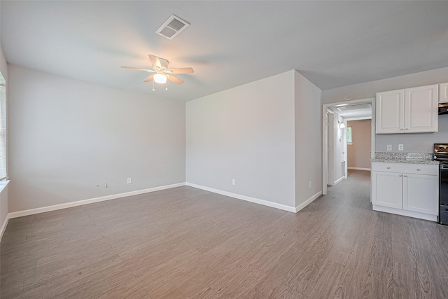 3602 Castledale Dr, Houston, TX 77093 - unfurnished living room with a ceiling fan and wood finished floors