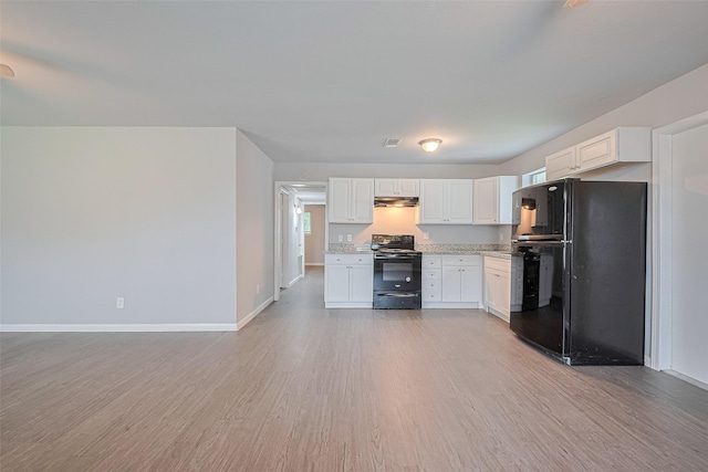 3602 Castledale Dr, Houston, TX 77093 - kitchen featuring black appliances, light wood-type flooring, under cabinet range hood, and white cabinetry