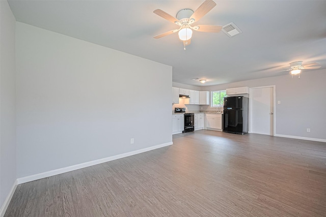3602 Castledale Dr, Houston, TX 77093 - unfurnished living room featuring a ceiling fan and wood finished floors