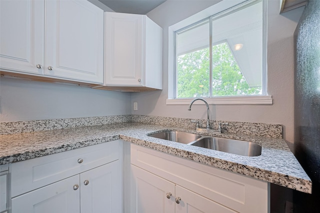 3602 Castledale Dr, Houston, TX 77093 - kitchen with white cabinetry and light stone counters