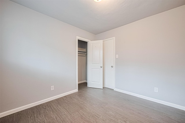 3602 Castledale Dr, Houston, TX 77093 - unfurnished bedroom featuring wood finished floors and a closet