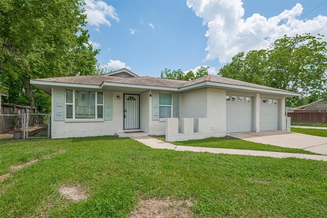 3602 Castledale Dr, Houston, TX 77093 - view of front of property featuring driveway, brick siding, a garage, and a shingled roof