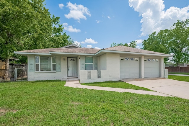 3602 Castledale Dr, Houston, TX 77093 - view of front of property featuring an attached garage, concrete driveway, brick siding, and roof with shingles