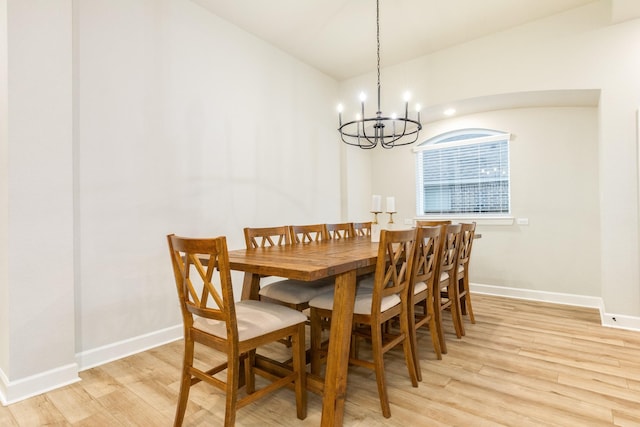 9806 Starry Night Ln, Manvel, TX 77578 - dining room featuring light wood-type flooring and a chandelier
