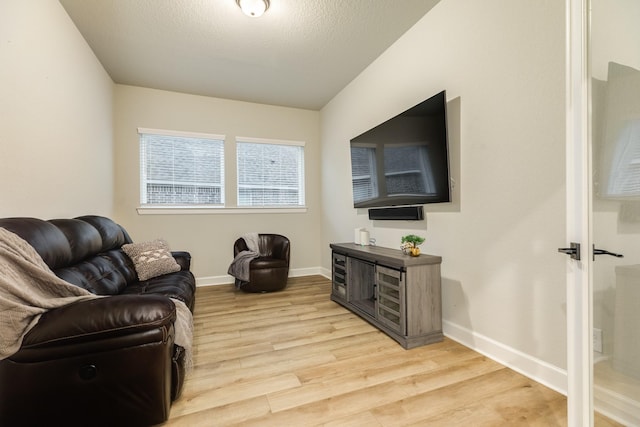 9806 Starry Night Ln, Manvel, TX 77578 - living room featuring light wood-style floors and baseboards